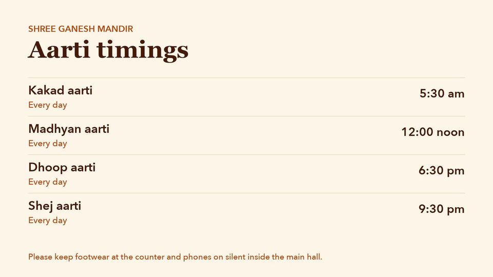 A temple TV with the day's aarti timings.